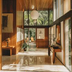 the inside of a house with wood paneling and large windows on either side of the room