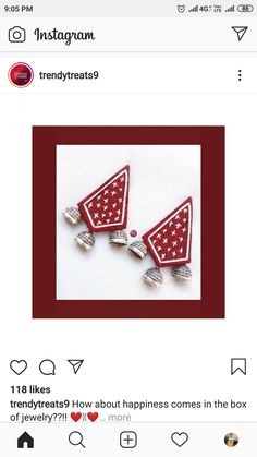 two red and white pins with stars on them, one is in the shape of a triangle