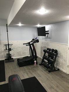 a home gym with treadmills and exercise equipment