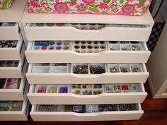 the drawers are filled with crafting supplies