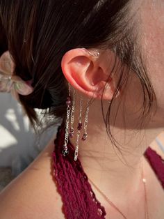 This Ear-Cuff is created with Silver-plated Copper and features gem-quality Garnet beads and surprise complimentary stones. Gold Cuffs can also be made upon request. "Almandine Garnet activates and strengthens the base chakra, our portal of connection to the physical world." - Robert Simmons, The Book of Stones.  Garnet Key Words: - Strength - Safety & Security - Protection - Manifestation of Desire - Passion Thank you for shopping and supporting small businesses! You can expect your order shipped out in 3-5 business days. All orders $50+ (shipping included) receive a free mini pendant. Red Ear Cuff, Protection Manifestation, Earring Cuffs, Wire Ear Cuffs, Lace And Beads, Base Chakra, Ear Accessories, Almandine Garnet, Wrap Earrings