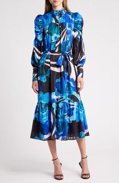 A bold floral pattern blossoms on this delightfully dynamic midi dress fashioned with a flared skirt, long sleeves and a matching belt for added structure. 49" length Hidden back-zip closure Band collar Long sleeves with zip cuffs Removable tie belt Partially lined 100% polyester Dry clean or hand wash, dry flat Imported Asian Owned/Founded Skirt Long, Sleeve Midi Dress, Band Collar, Long Sleeve Midi, Blue Midi Dress, Long Sleeve Midi Dress, Flared Skirt, Nordstrom Dresses, Tie Belt