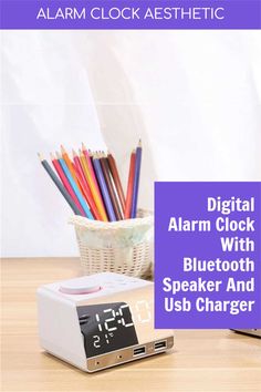 alarm clock with bluetooth speaker and usb charger next to it on a table