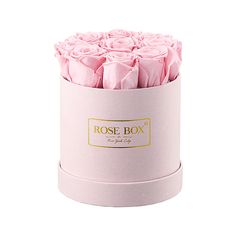 a pink box with roses in it on a white background