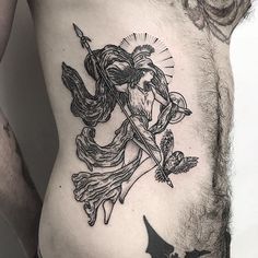 a man with a tattoo on his stomach holding a bat and wearing a devil's head