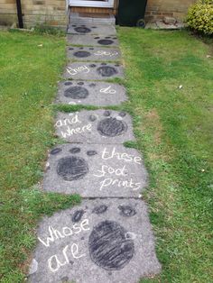 some chalk drawings on the sidewalk in front of a door