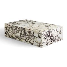 a white and black marble box sitting on top of a table