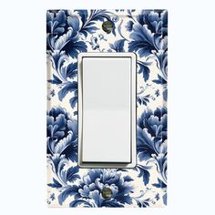 a blue and white flowered light switch cover with a single outlet in the middle