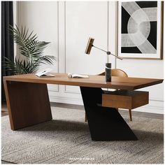 a desk with a lamp on it in a room next to a painting and potted plant