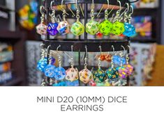 Amazing Mini D20 (10mm) dice earrings for yourself or that special gamer in your life. Gain +2 to charisma while sporting one of the many dice earrings that we have made. Show off your love for all things tabletop RPG and D&D with this piece of jewelry. Great for any dungeons and dragons player, dice jewelry collector, mini dice lover, dice goblins and dragons or anyone who has a love for all the clickety clacks. Each Dice is hand drilled, threaded and hand looped. All while making sure that the Dice Jewelry, Dice Earrings, Tabletop Rpg, Royal Purple, How To Make Earrings, Fish Hook, Cute Earrings, Gift Registry, Dungeons And Dragons