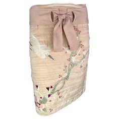 Presenting a stunning light pink Gucci embroidered skirt, designed by Tom Ford. From the Spring/Summer 2003 collection, this ombré pink pencil skirt is constructed of lightweight silk ribbon. The skirt features a built-in tie belt and is made complete with a gorgeous cherry blossom that wraps around the skirt. This iconic cherry blossom embroidery was heavily featured on the season's runway. A must-have piece for any Gucci by Tom Ford lover, this pink skirt is a beautiful addition to any wardrobe or collection. Approximate measurements: Size - removed Waistband to hem: 21" Waist: 30" Hips: 36" 100% Silk Pink Embroidered Skirt, Embroidered Pink Skirt For Summer, Embroidered Pink Summer Skirt, Fitted Pink Embroidered Skirt, Summer Embroidered Pink Skirt, Spring Beige Silk Skirt, Blossom Embroidery, Gucci By Tom Ford, Pink Pencil