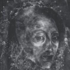 an old woman's face is shown in this black and white photo with ornate details