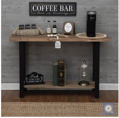 a coffee bar with various items sitting on it's shelf and next to the wall