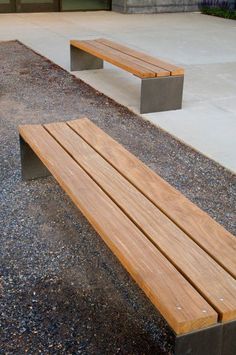 two wooden benches sitting next to each other