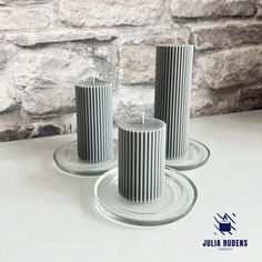 three candles sitting on top of each other