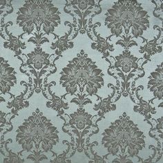 a blue and brown wallpaper with an ornate design