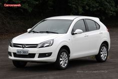 a white car parked in a parking lot