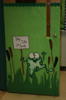 the door is decorated with an image of a frog