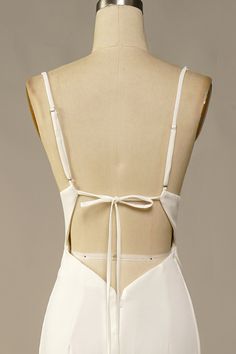 the back of a white dress on a mannequin headdress with straps