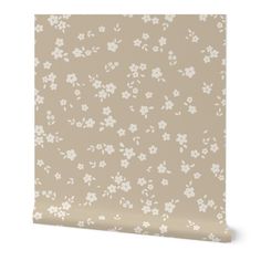 a beige wallpaper with white flowers on it