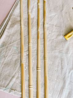 three bamboo sticks sitting on top of a table