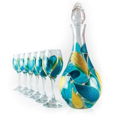 a set of wine glasses and a decanter