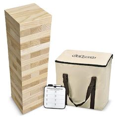 a wooden box with two different items in it and a bag next to it on a white background