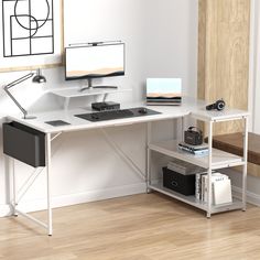 a computer desk sitting on top of a hard wood floor next to a white wall