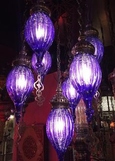 purple lights hanging from the ceiling in a room