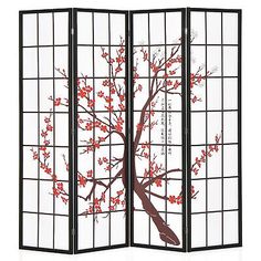 a room divider with a tree painted on the side and red flowers in it