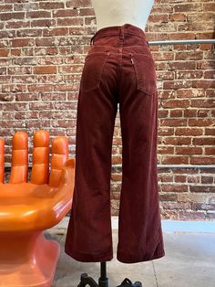 70s Levi's Cabernet Corduroy Flared Jeans Gorgeous seventies Levi's corduroy flared jeans. Talon 42 zipper fly with Levi's signature button closure at the waist. Front and back pockets. Belt loops for your favorite 70s belt. The color is so good! Levi's white tab on the back pocket. These are extremely old Levi's. The Levi's button and the zipper are oxidized. Demarcation and discoloration through out, especially where the hem has been taken down. A fray and a mend near the right hem. A fray on the right front pocket and slightly frayed at the waist. I've added as many photos as I can of this. I love these 70s Levi's and I think the imperfections make them look that much cooler. Please DO NOT purchase if the imperfections bother you.  Measurements: 28" waist 37" hip-hip measurement is key, 70s Style Jeans, 70s Street Fashion, 70s Jeans Outfit, Authentic 70s Fashion, 60s Jeans, 70s Winter Fashion, 70s Trousers, 70s Cottagecore, 70s Inspired Outfits