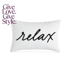 a pillow that says relax on it with the words give love, give style in black ink