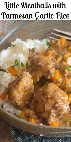 meatballs with parmesan garlic rice and carrots in a bowl on a wooden table