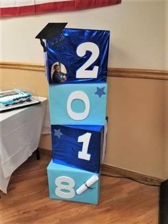 a blue block with the number two on it and a graduation cap sitting on top