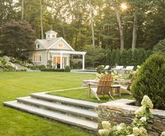 an outdoor patio with steps leading up to the house