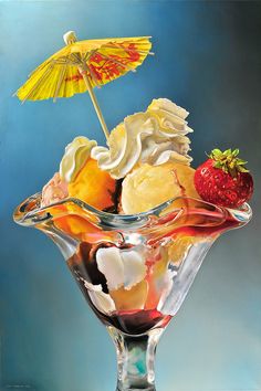 an ice cream sundae in a glass bowl with strawberries and umbrella on top