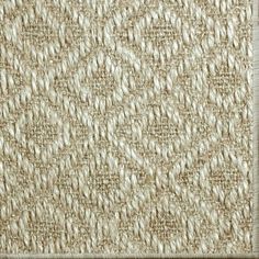 a close up view of the texture of woven fabric, which is beige and white