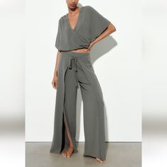 Fluid Mid Rise Pants With Elastic Waistband Over Lapping Wrap Front With Self Tie Fastening Wide Leg. Flowt Wrap Top** Size Large Short Sleeve Wrap Top With V Neckline Side Pleats Versatile Jumpsuits And Rompers For Loungewear With Elastic Waistband, Summer Loungewear Pant Set With Straight Pants, Solid Color Wide Leg Jumpsuits And Rompers For Loungewear, Solid Color Wide Leg Jumpsuits For Loungewear, Wide-leg Jumpsuits And Rompers With Elastic Waistband For Loungewear, Wide-leg Jumpsuits For Loungewear, Wide Leg Stretch Jumpsuits And Rompers For Loungewear, Stretch Wide Leg Jumpsuits For Loungewear, Wide Leg Loungewear Jumpsuit