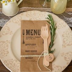 a place setting with utensils and napkins