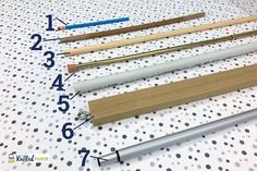 several different types of pencils and rulers on a polka dot tablecloth with numbers