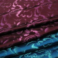 three different colored fabrics with designs on them