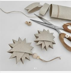 some scissors and other crafting supplies on a table