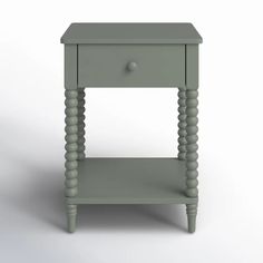 a small grey table with two drawers on one side and an open drawer on the other