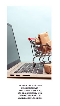 a shopping cart sitting on top of a laptop computer