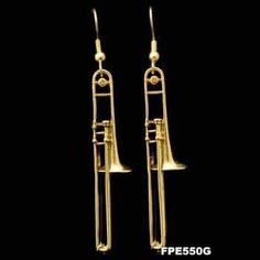 a pair of gold tone musical instruments earrings with long ear wires, on a black background