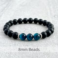 Matte Onyx and Tri-Aqua Blue Tiger Eye Bracelet – FujiBeads Mens Jewelry Diy, Blue Tiger Eye Bracelet, Bracelet Man, Blue Tiger Eye, Slide Bracelet, Blue Beaded Bracelets, Blue Tiger, Labradorite Bracelet, Tiger Eye Bracelet