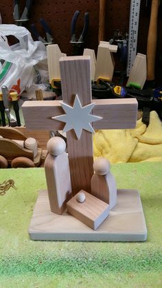 a wooden cross sitting on top of a table