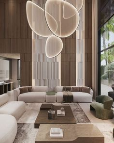 a modern living room with white couches and large chandelier hanging from the ceiling