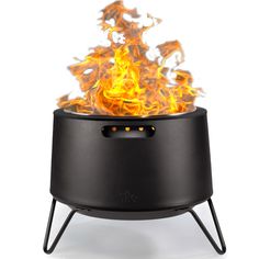 an outdoor fire pit with flames coming out of the top and on it's sides