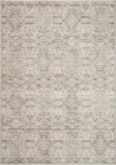 an area rug with different colors and patterns on the carpet, including beiges and browns